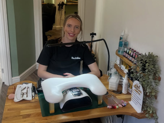 Chelsea providing nail services at Revitalise